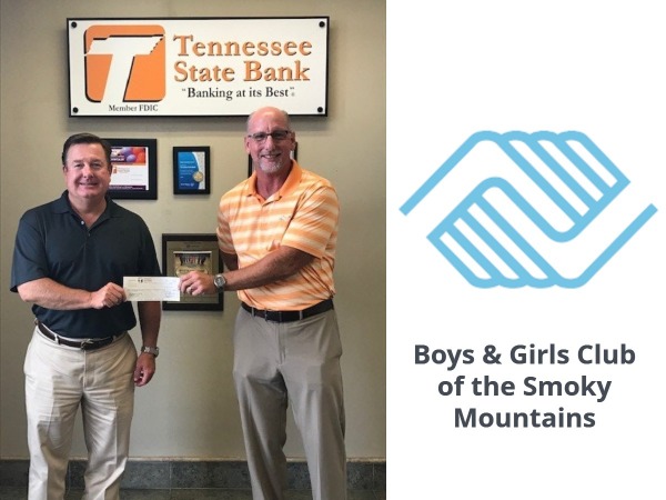 Todd Proffitt, CEO hands check to Boys & Girls Club Director